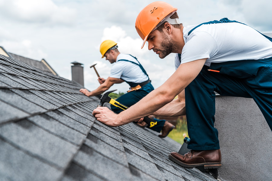 men installing a roof